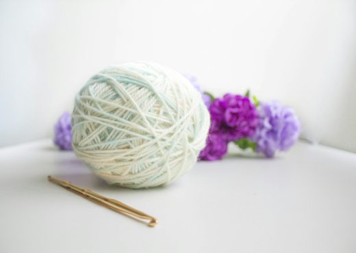 green and purple yarn ball